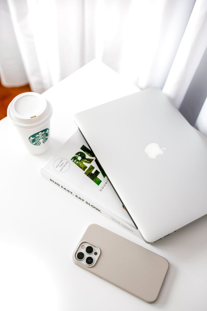 Clean minimalist workspace with laptop and coffee cup